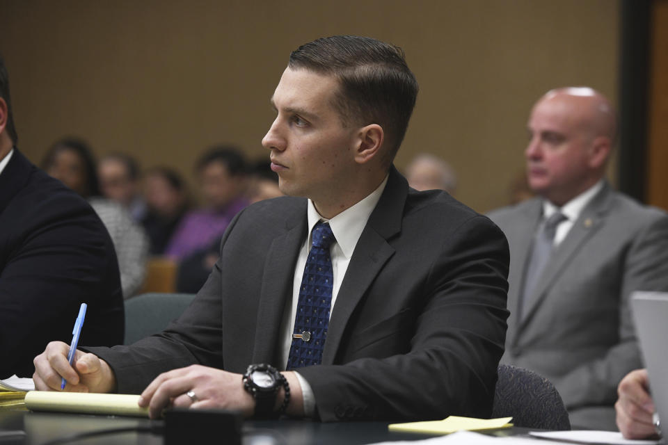 State Trooper Brian North listens to testimony in Connecticut Superior Court on the eighth day of his trial in Milford, Conn., Wednesday, March 13, 2024. North is charged with manslaughter for shooting 19-year-old Mubarak Soulemane in January 2020 in West Haven after a chase from Norwalk on Interstate 95. (Ned Gerard/Hearst Connecticut Media via AP, Pool)