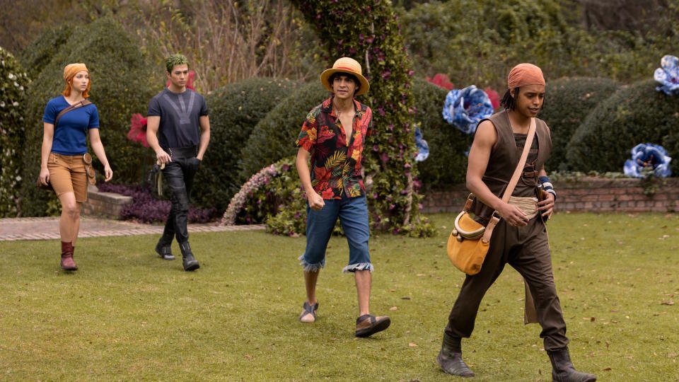 One Piece Straw Hats walk across a lawn in Netflix still