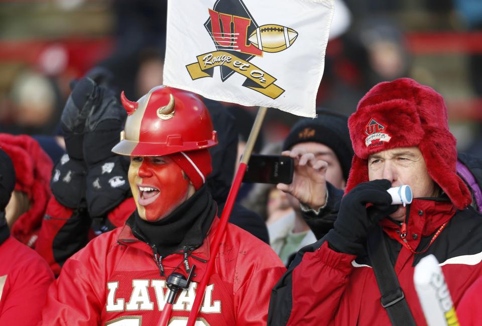 Laval Rouge et Or fans watch their team play the Calgary Dinos during the Vanier Cup University Championship football game in Quebec City, Quebec, November 23, 2013. REUTERS/Mathieu Belanger (CANADA - Tags: SPORT FOOTBALL)