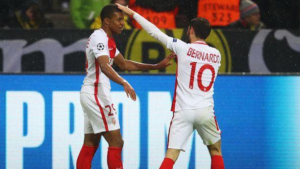 Bernardo Silva touches Kylian Mbappe's head in celebration - both playing for Monaco.