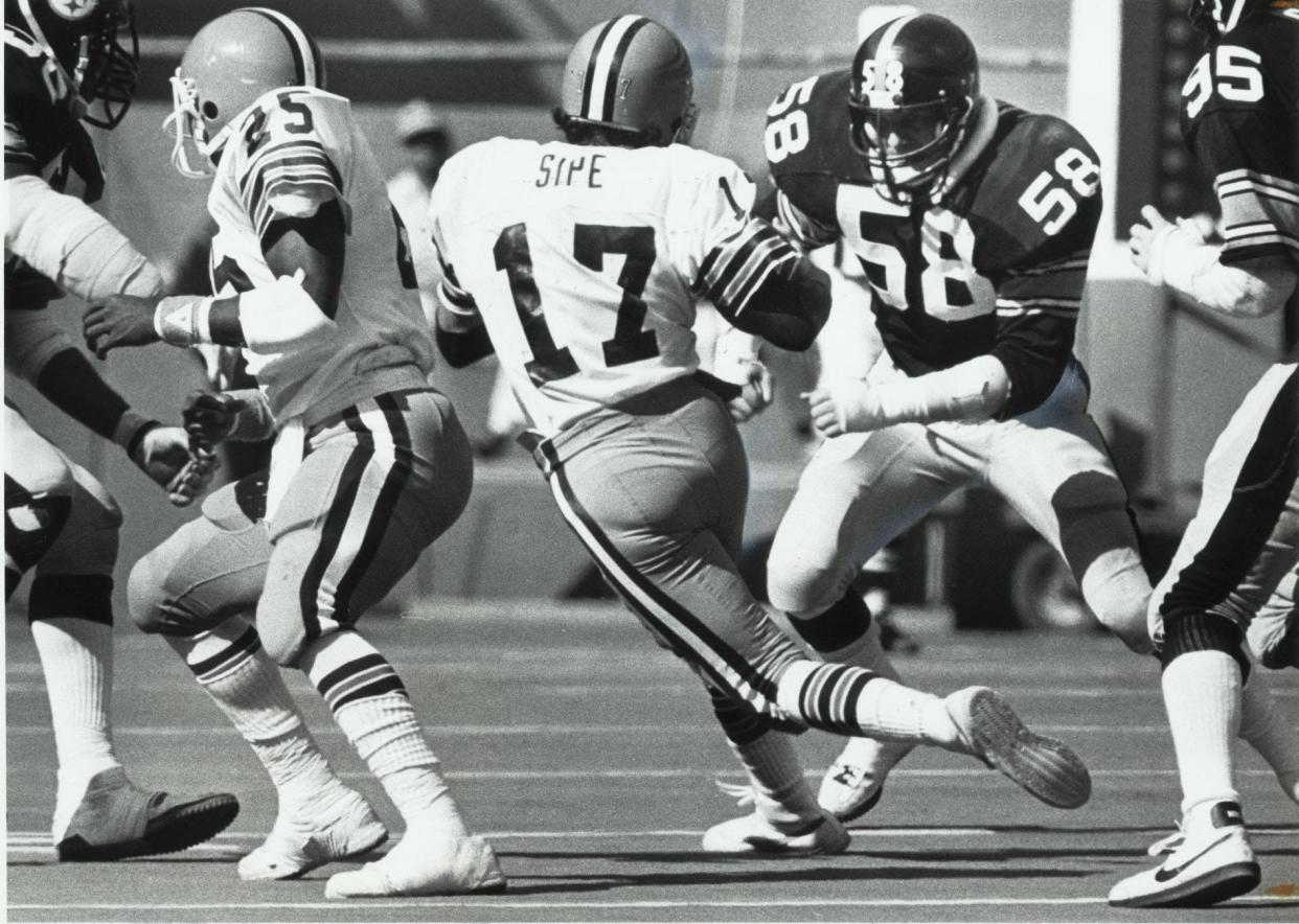 Browns quarterback Brian Sipe tries to elude Steelers middle linebacker Jack Lambert in a 1981 game. Lambert was ejected later in the game for a hit on Sipe that put the reigning NFL MVP out of commission.
