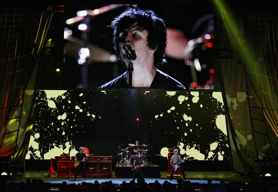 Green Day performs to open the 2012 Rock and Roll Hall of Fame induction ceremonies Saturday, April 14, 2012, in Cleveland. Green Day introduce Guns N' Roses for induction into the Rock and Roll Hall of Fame. (AP Photo/Tony Dejak)