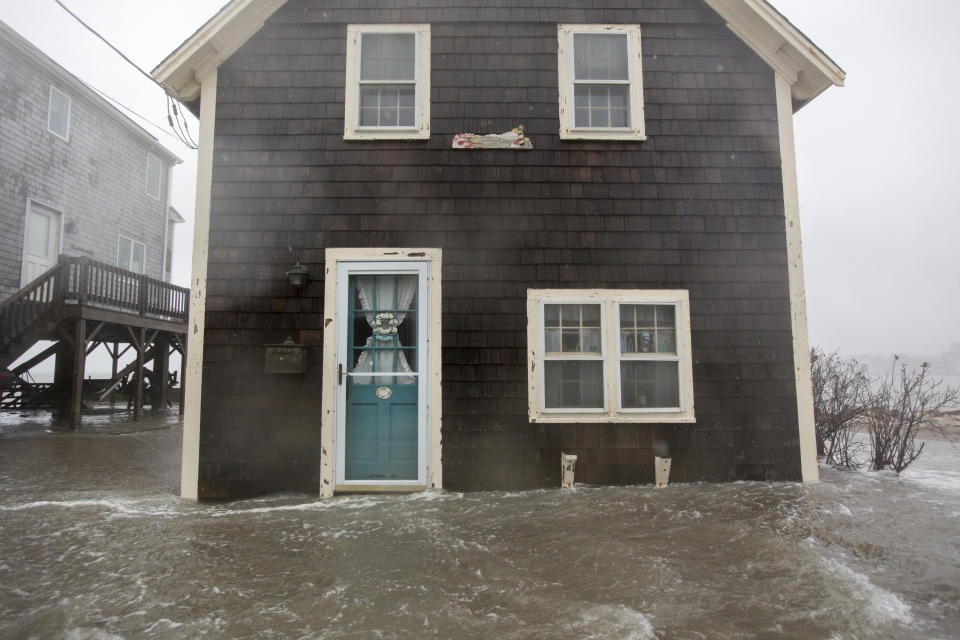 <p>Floodwaters near the entrace to a home on Lighthouse Rd. during a large coastal storm on March 2, 2018 in Scituate, Mass. (Photo: Scott Eisen/Getty Images) </p>