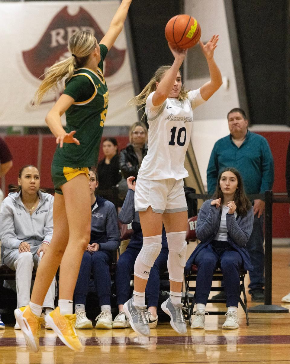 Squan Olivia Shaughnessy puts up a late three pointer during closing minutes of game. Red Bank Catholic vs Manasquan in SCT Girls Basketball Semifinal on February 15, 2024 in Red Bank. NJ.