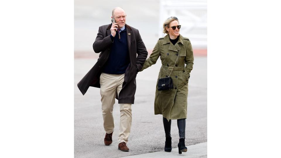 Mike Tindall and Zara Tindall walking at Cheltenham Racecourse