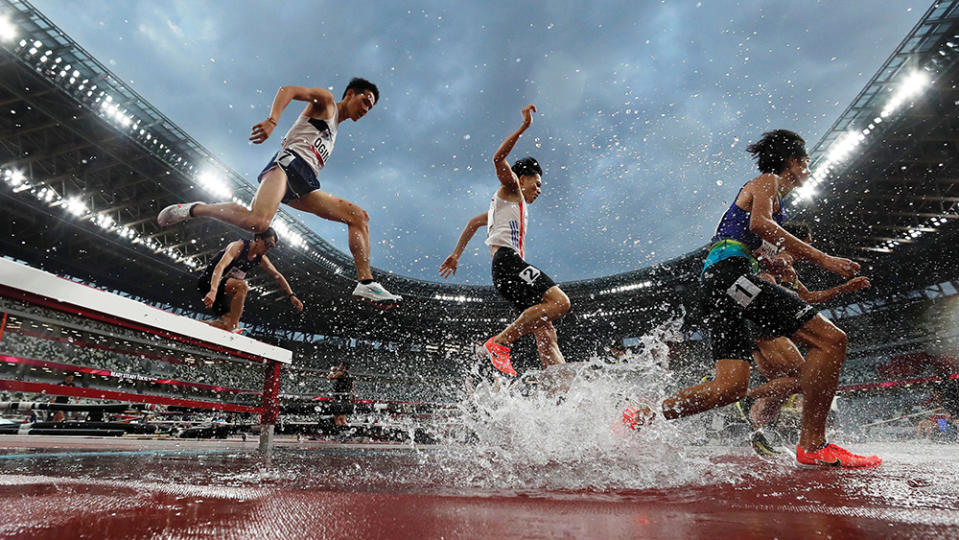 Competitors leaping hurdles at during a test event during the Olympic games. - Credit: Issei Kato/Reuters