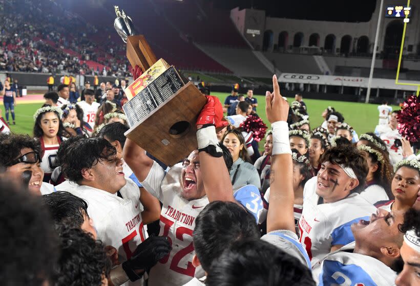 Los Angeles, California October 21, 2022- Garfield palmers celebrate their win over Roosevelt.