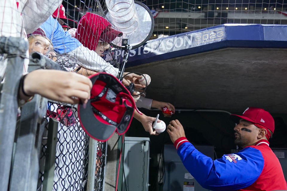 Philadelphia Phillies right fielder Nick Castellanos signs autographs before Game 1 of the baseball NL Championship Series in Philadelphia, Monday, Oct. 16, 2023. (AP Photo/Matt Slocum)