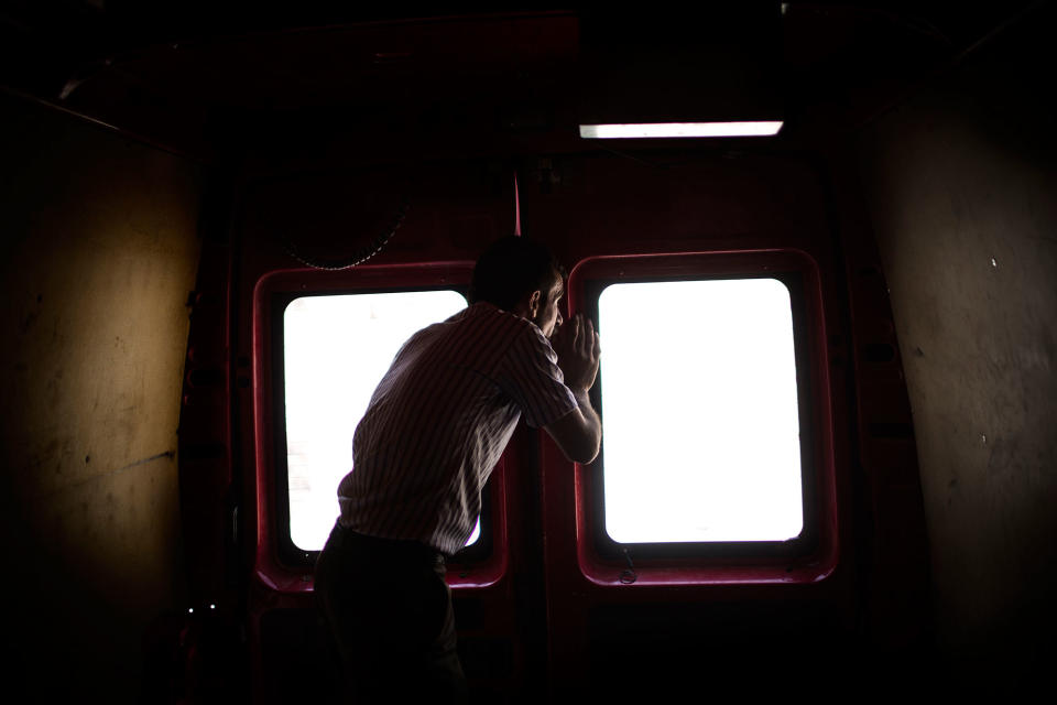 <p>Mohammed looks through the window of a civil defense rescue team vehicle while on his way to find his relatives killed after an airstrike in Mosul. West Mosul. Iraq. July 2, 2017. (Photograph by Diego Ibarra Sánchez / MeMo) </p>