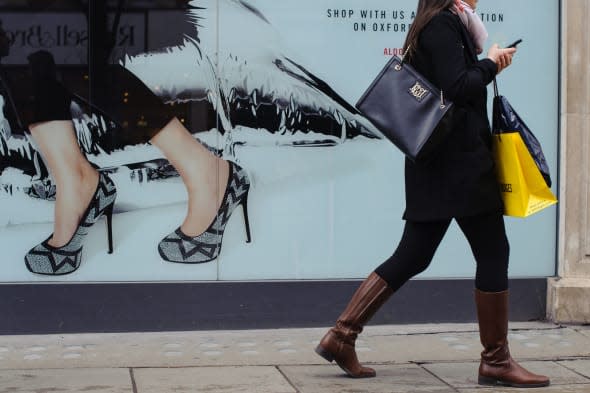 File photo dated 17/01/14 of a shopper on Oxford Street, in central London as retail sales staged a bigger-than-expected bounce-back last month as shoppers returned to the high street after a weather-hit January, according to official figures. PRESS ASSOCIATION Photo. Issue date: Thursday March 27, 2014. The Office for National Statistics (ONS) said sales volumes rose 1.7% month on month in February, smashing forecasts for sales to edge 0.5% higher. It comes after a disappointing January, with the ONS revealing that sales fell even more than first thought, down by 2% against an initial estimate for a 1.5% decline. See PA story ECONOMY Retail. Photo credit should read: Dominic Lipinski/PA Wire