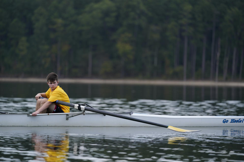 Callum Bradford takes a break during a rowing club team practice at Jordan Lake, Friday, Oct. 6, 2023, in Apex, N.C. Bradford, a transgender teen from Chapel Hill needed mental health care after overdosing on prescription drugs. He was about to be transferred to another hospital due to a significant bed shortage. A North Carolina hospital network is referring transgender psychiatric patients to treatment facilities that do not align with their gender identities. Though UNC Hospitals policy discourages the practice, administrators say a massive bed shortage is forcing them to make tough decisions.(AP Photo/Erik Verduzco)