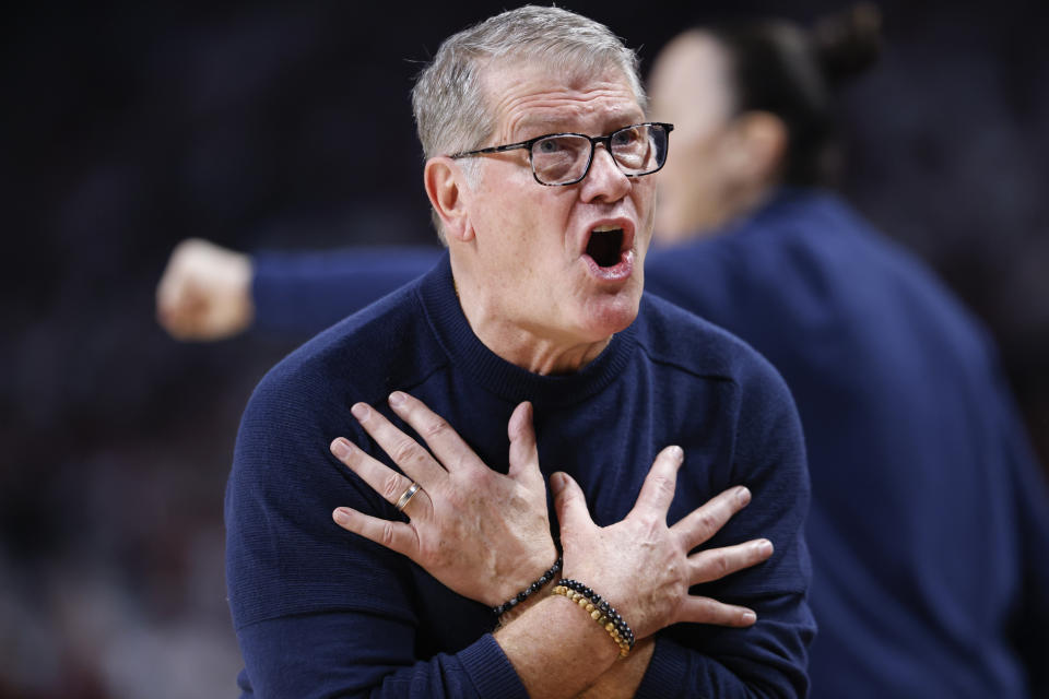 UConn head coach Geno Auriemma tells his team to take a charge during the first half of an NCAA college basketball game against South Carolina in Columbia, S.C., Sunday, Feb. 11, 2024. (AP Photo/Nell Redmond)