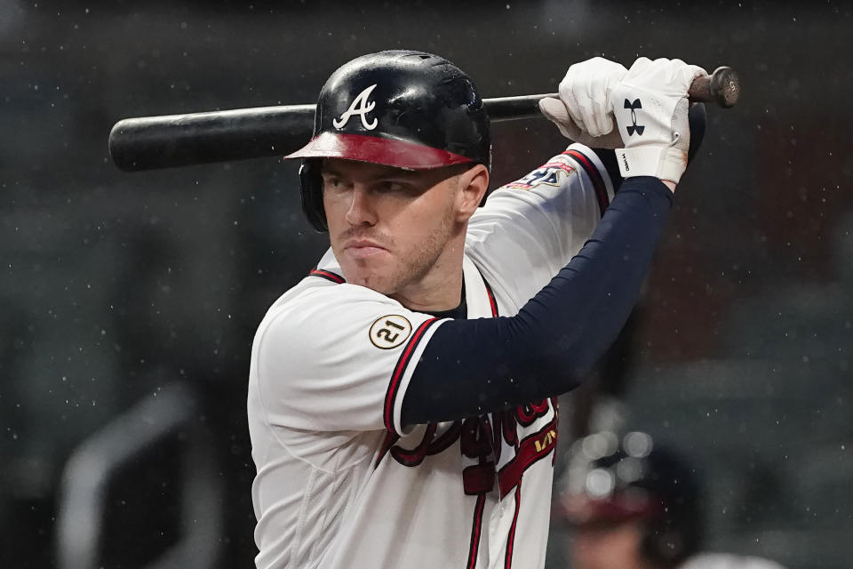 FILE - Atlanta Braves first baseman Freddie Freeman (5) bats during a baseball game against the Colorado Rockies on Sept. 15, 2021, in Atlanta. There are 141 major league free agents waiting for a freeze on roster transactions to lift upon the agreement of a new collective bargaining agreement. Carlos Correa, Freddie Freeman and Kris Bryant are among the top players still on the market. (AP Photo/John Bazemore, File)