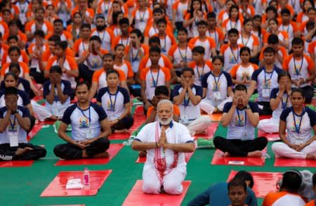 FILE PHOTO: Indian Prime Minister Narendra Modi performs yoga on International Yoga Day in Lucknow, India June 21, 2017. REUTERS/Pawan Kumar/File Photo