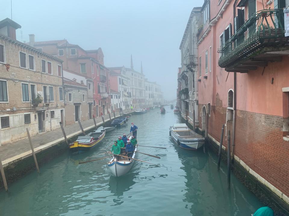 Boat in Venice, in the evening fog