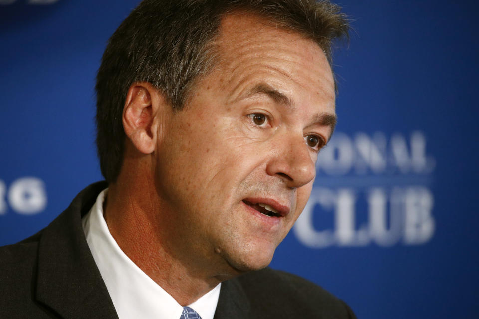 FILE - In this Aug. 7, 2019 file photo, Democratic presidential candidate Montana Gov. Steve Bullock speaks at the National Press Club in Washington. Bullock was told how he could qualify for the next presidential debate, but it didn’t make much sense: Spend $60. Attract a $1 donor. And repeat, maybe thousands of times. (AP Photo/Patrick Semansky)