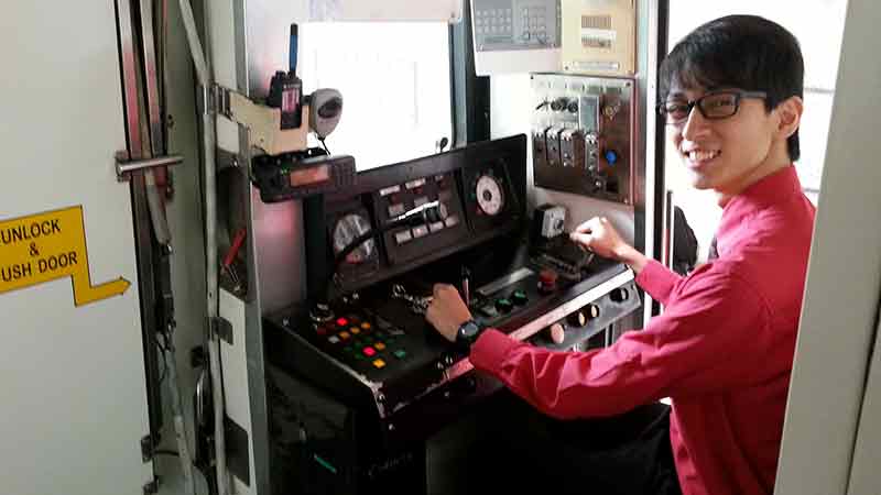 SMRT train captain Tan Ming Hui, 23, does a repeat of his cheerful announcement that recently went viral on the internet.