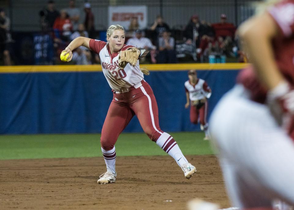 May 11, 2023; Fayetteville, AK, USA; Arkansas Razorbacks utility Hannah Gammill (20) throws to first base for an out during a quarterfinal game against the Alabama Crimson Tide in the SEC Softball Tournament. Mandatory Credit: Brett Rojo-USA TODAY Sports