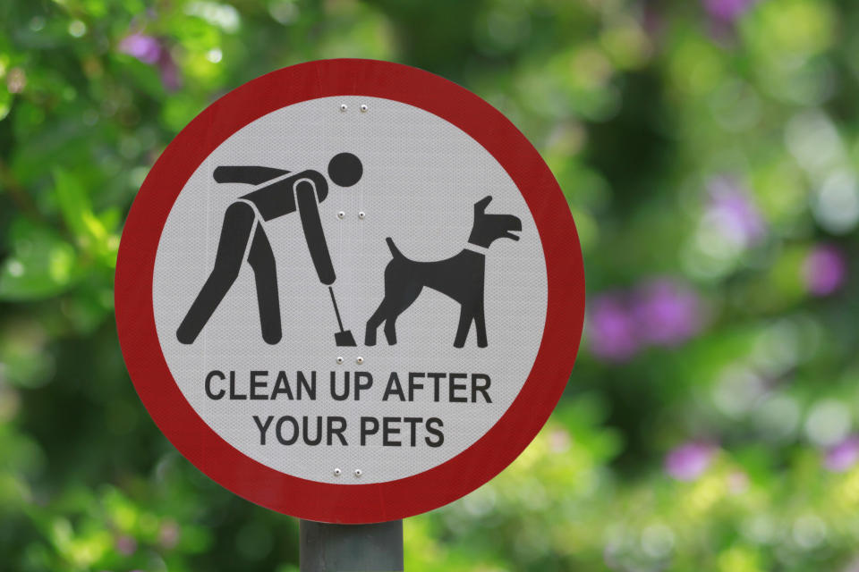 "Clean up after your pets" sign at the park