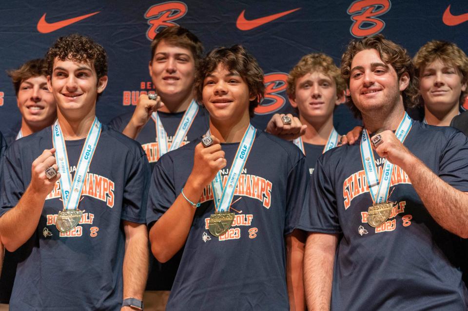 The Benjamin School boys golf team show off their new rings at a ceremony to celebrate their 2023 state championship at the school on March 26, 2024 in Palm Beach Gardens, Florida.