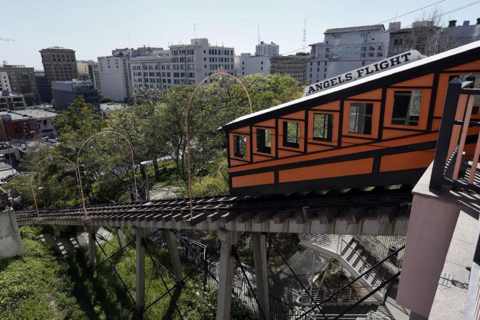 Angels Flight railway is seen in the Bunker Hill section of Los Angeles on Wednesday, March 1, 2017. The tiny funicular that hauled people 298 feet up and down the city's steep Bunker Hill was shut down in 2013 after a series of safety problems. At a news conference Wednesday, March 1, Los Angeles Mayor Eric Garcetti said those issues are being resolved and the railroad's antique wooden cars should be back in service by Labor Day.(AP Photo/Nick Ut)