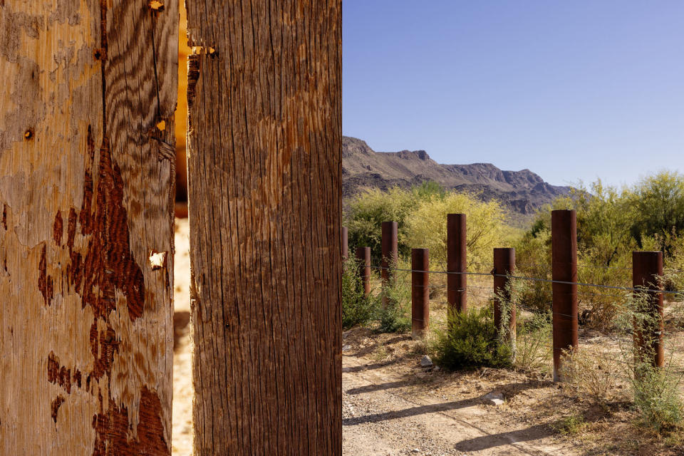 Bullet holes visible in the wooden walls of Raymond Mattia’s house; The border, marked only by metal stakes pounded into the desert. (Cassidy Araiza for NBC News)