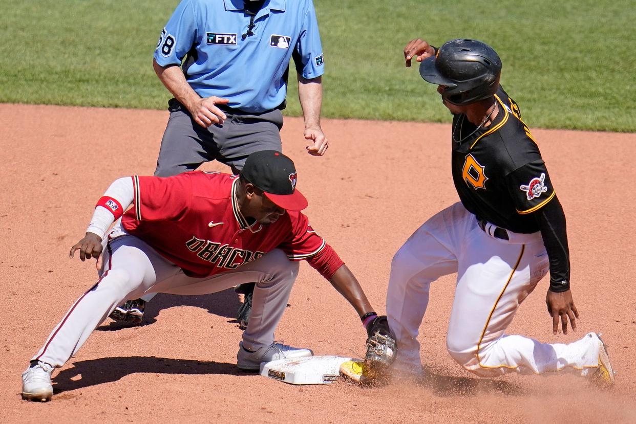 Pittsburgh Pirates' Ke'Bryan Hayes, right, steals second, with Arizona Diamondbacks second baseman Ketel Marte applying the late tag, during the seventh inning of a baseball game in Pittsburgh, Sunday, June 5, 2022. (AP Photo/Gene J. Puskar)