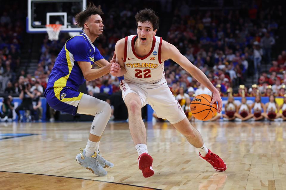 OMAHA, NEBRASKA - MARCH 21: Milan Momcilovic #22 of the Iowa State Cyclones dribbles the ball against Zeke Mayo #2 of the South Dakota State Jackrabbits during the first half in the first round of the NCAA Men's Basketball Tournament at CHI Health Center on March 21, 2024 in Omaha, Nebraska. (Photo by Michael Reaves/Getty Images)