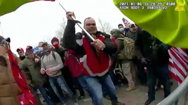 PHOTO: A still from Metropolitan Police Department body worn camera video shows Thomas Webster, in red jacket, at a barricade line at on the west front of the Capitol in Washington, D.C., on Jan. 6, 2021. (Metropolitan Police Department via AP, FILE)