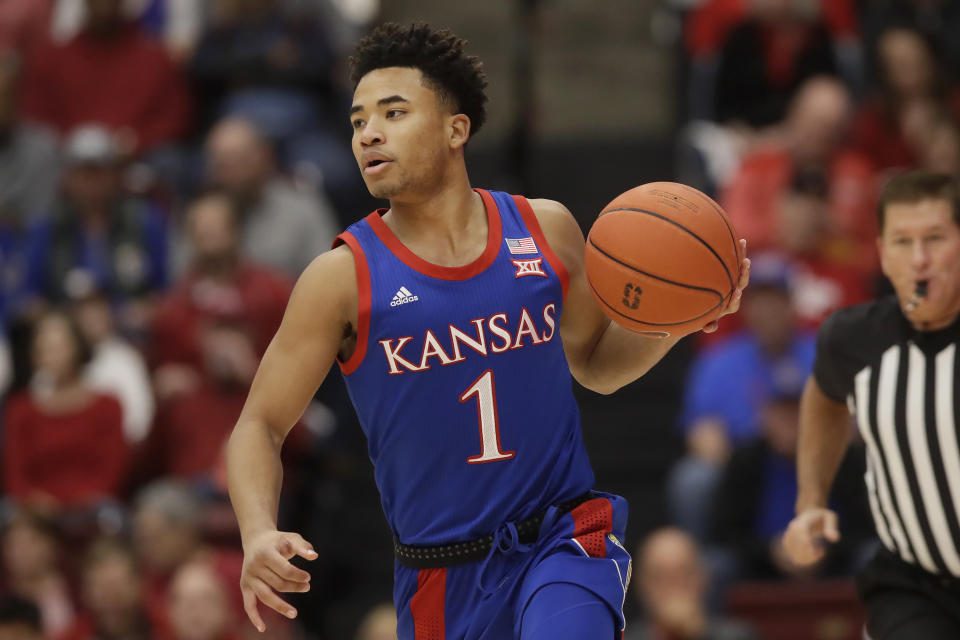 Kansas guard Devon Dotson dribbles upcourt against Stanford during the first half of an NCAA college basketball game in Stanford, Calif., Sunday, Dec. 29, 2019. (AP Photo/Jeff Chiu)