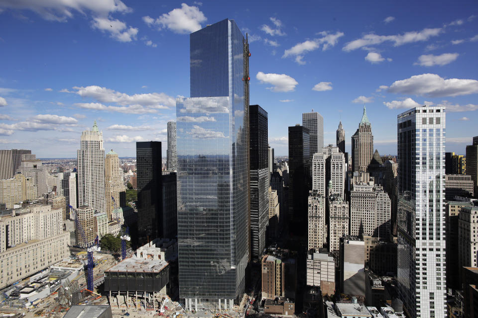 FILE - 4 World Trade Center, center, the 978-foot building designed by Pritzker Prize-winning architect Fumihiko Maki, rises above the lower Manhattan skyline in New York on Sept. 5, 2013. Japanese architect Maki, who won the prestigious Pritzker Prize for designs praised as smartly and artfully fusing the East with the West, has died. He was 95. Maki, who taught architecture and urban design at Harvard, died June 6, his office Maki & Associates said Wednesday, June 12, 2024. (AP Photo/Mark Lennihan, File)