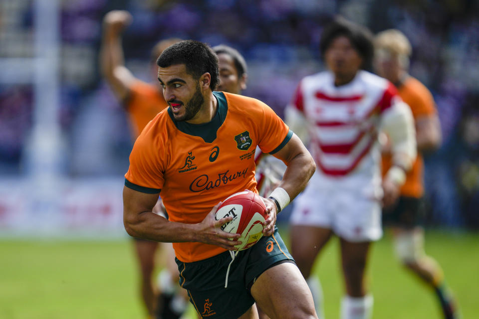 Australia's Tom Wright runs in to score his team's first try during the rugby international between the Wallabies and Japan in Oita, Japan, Saturday, Oct. 23, 2021. (AP Photo/Hiro Komae)