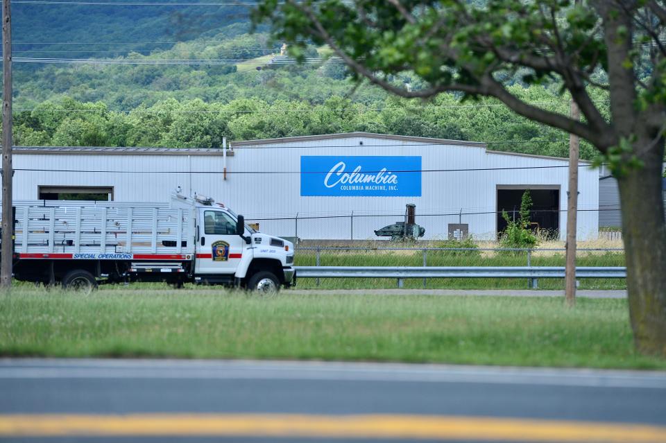 Washington County Sheriff's Office deputies investigate following a mass shooting at Columbia Machine near Smithsburg, Md., Thursday.