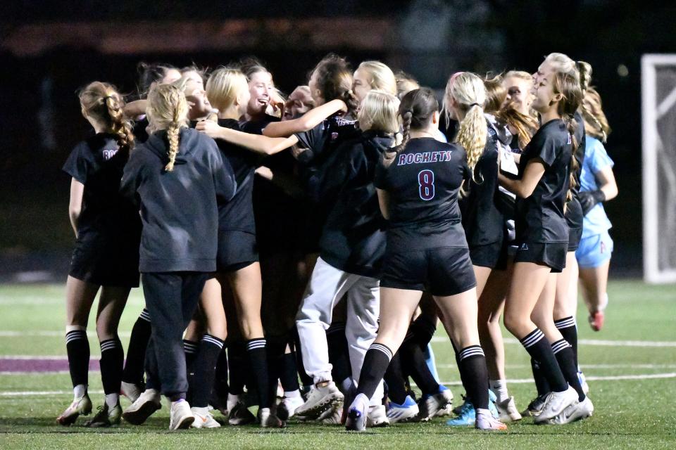 Assumption players celebrate after their 4-1 victory over Manual in the championship game of the 7th Region girls soccer tournament, Saturday, Oct. 15, 2022 in Louisville Ky. 