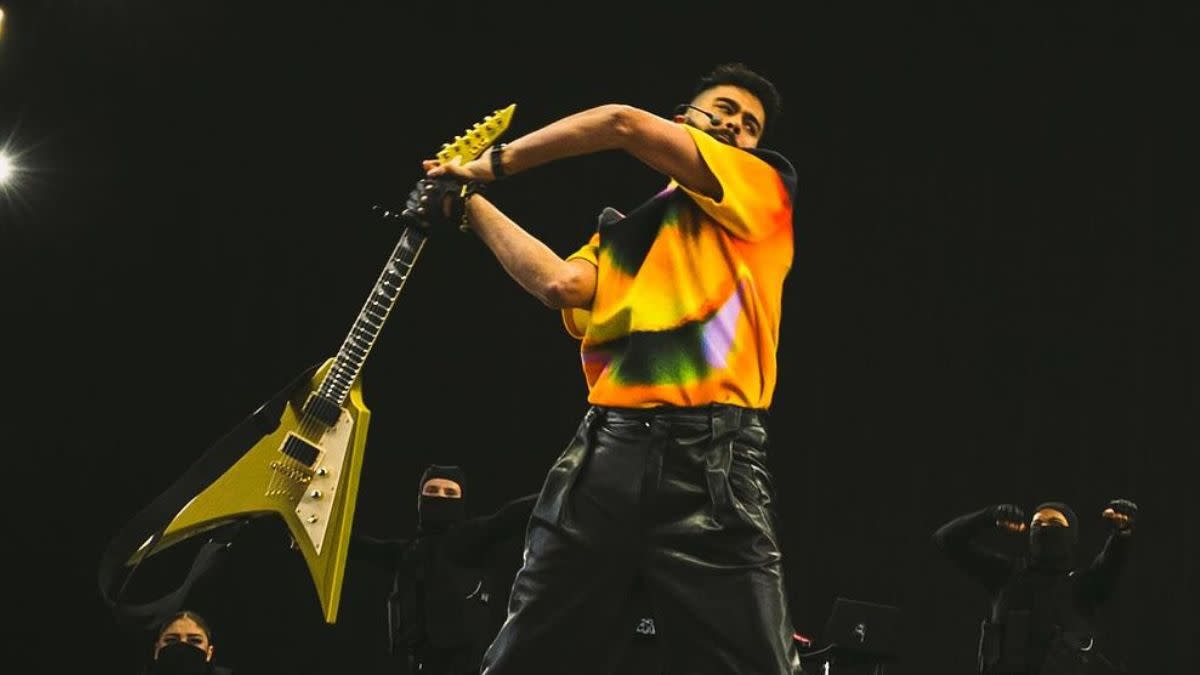  AP Dhillon smashing his guitar on stage at Coachella. 