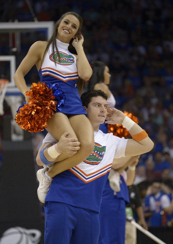 Florida cheerleaders perform during the second half in a third-round game in the NCAA college basketball tournament against Pittsburgh, Saturday, March 22, 2014, in Orlando, Fla. (AP Photo/Phelan M. Ebenhack)