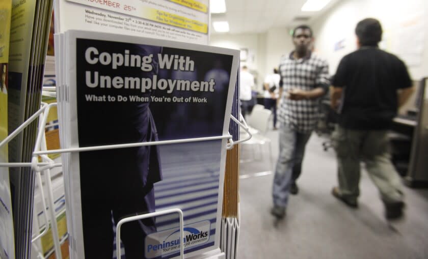 FILE - In this July 20, 2010 file photo, people arrive to seek employment opportunities at a JobTrain office in Menlo Park, Calif. On Monday, Aug. 24, 2020, Employment Development Department Director Sharon Hilliard told California lawmakers in Sacramento, California, the state has more than 1 million pending claims for unemployment benefits. Hilliard called the situation "shameful," but said the department is working through the backlog. (AP Photo/Paul Sakuma, File)