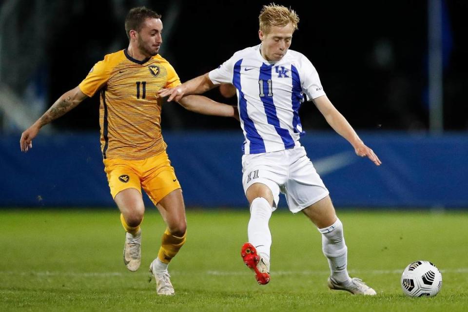 West Virginia midfielder Luke McCormick (11) and Kentucky forward Mason Visconti (11) battle for the ball during a game at the Wendell & Vickie Bell Soccer Complex in Lexington, Ky., Tuesday, Oct. 19. 2021. Kentucky defeated West Virginia 1-0 in double overtime.