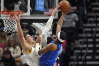 Utah Jazz center Walker Kessler, left, blocks Dallas Mavericks guard Jaden Hardy (3) during the second half of an NBA basketball game Monday, Feb. 6, 2023, in Salt Lake City. (AP Photo/Rick Bowmer)