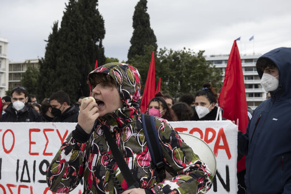 Protesters take part in an anti-government rally at central Syntagma square in Athens, on Saturday, Jan. 22, 2022. Hundreds protesters gathered to protest staff shortages in state heath sector and compulsory coronavirus vaccinations. (AP Photo/Yorgos Karahalis)