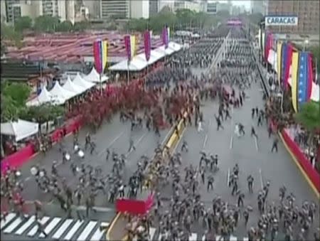 Venezuelan National Guard soldiers run during an event which was interrupted, in this still frame taken from video August 4, 2018, Caracas, Venezuela. VENEZUELAN GOVERNMENT TV/Handout via REUTERS TV