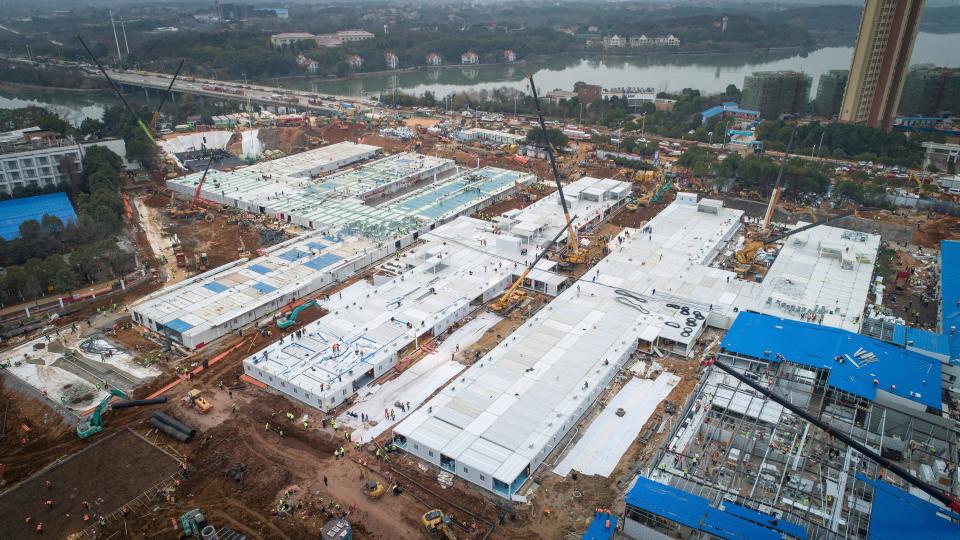 This Feb. 1 photo released by China's Xinhua News Agency shows construction workers at the site.