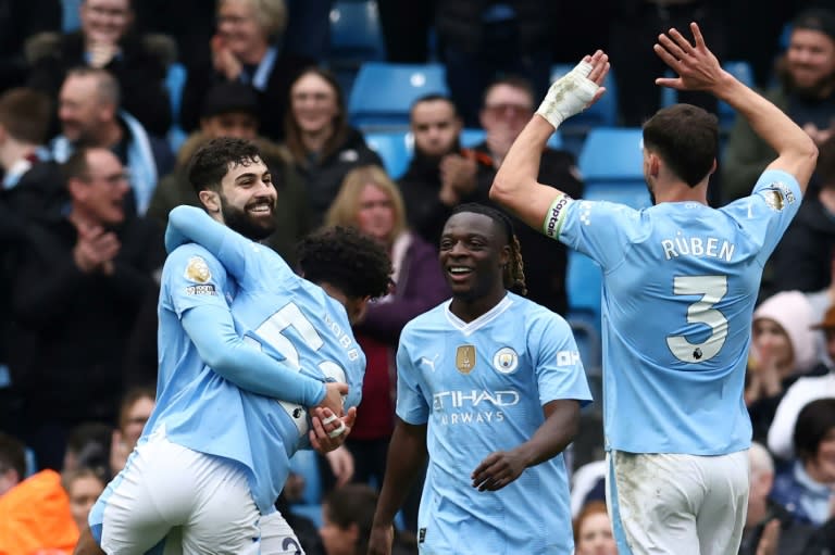 <a class="link " href="https://sports.yahoo.com/soccer/teams/man-city/" data-i13n="sec:content-canvas;subsec:anchor_text;elm:context_link" data-ylk="slk:Manchester City;sec:content-canvas;subsec:anchor_text;elm:context_link;itc:0">Manchester City</a> beat <a class="link " href="https://sports.yahoo.com/soccer/teams/luton/" data-i13n="sec:content-canvas;subsec:anchor_text;elm:context_link" data-ylk="slk:Luton;sec:content-canvas;subsec:anchor_text;elm:context_link;itc:0">Luton</a> 5-1 to go two points clear at the top of the Premier League (Darren Staples)