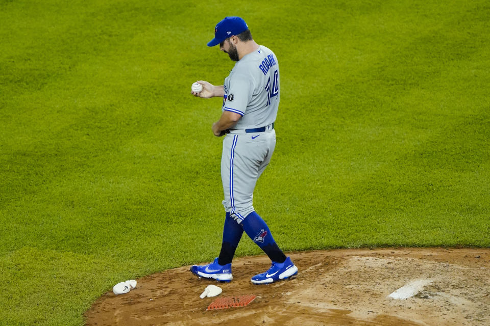 Toronto Blue Jays starting pitcher Tanner Roark reacts as New York Yankees' DJ LeMahieu runs the bases after hitting a two-run home run during the fourth inning of a baseball game Wednesday, Sept. 16, 2020, in New York. (AP Photo/Frank Franklin II)