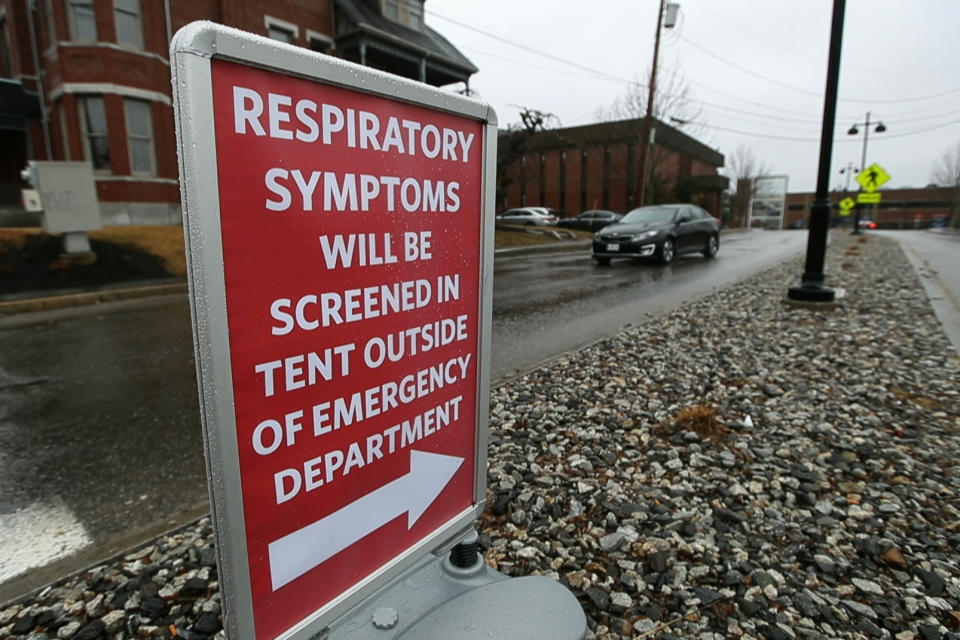 A sign directs patients with respiratory symptoms to a tent at the Central Maine Medical Center, Friday, March 13, 2020, in Lewiston, Maine. The hospital is using the tent to make preliminary test for patients with coronavirus symptoms. (AP Photo/Robert F. Bukaty)