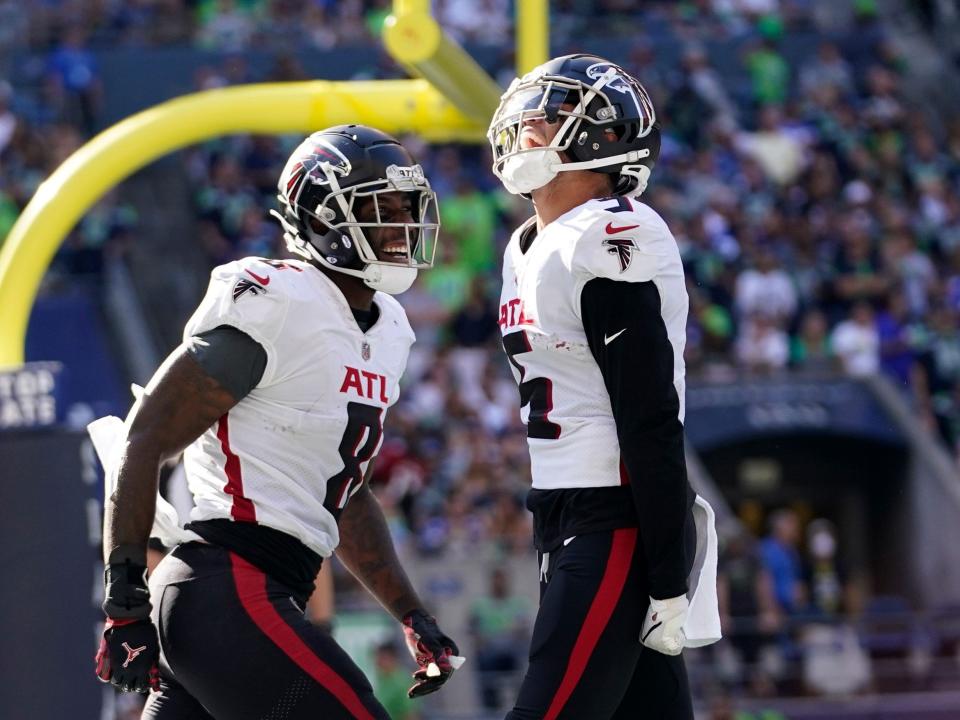 Drake London celebrates after scoring a touchdown against the Seattle Seahawks.