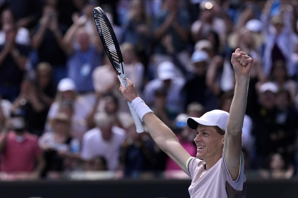 Jannik Sinner of Italy celebrates after defeating Novak Djokovic of Serbia in their semifinal at the Australian Open tennis championships at Melbourne Park, Melbourne, Australia, Friday, Jan. 26, 2024. (AP Photo/Andy Wong)