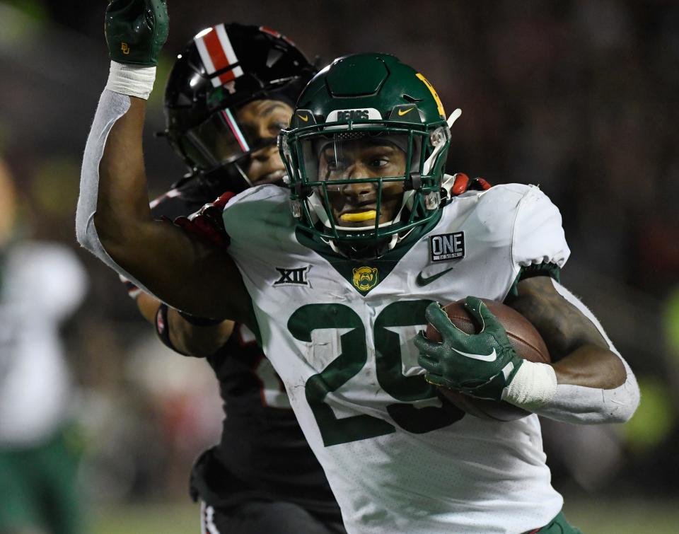 Baylor's running back Richard Reese (29) runs with the ball at the game against Texas Tech, Saturday, Oct. 29, 2022, at Jones AT&T Stadium. 