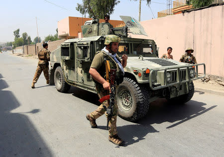 Afghan security forces arrive at the site of gunfire and attack in Jalalabad city, Afghanistan July 11, 2018. REUTERS/Parwiz