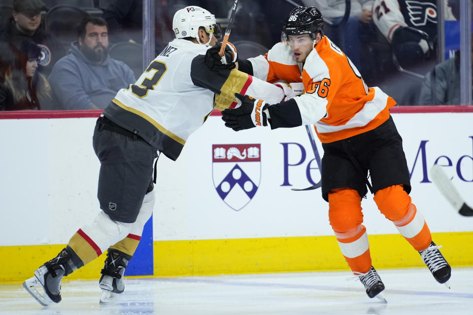 Vegas Golden Knights' Alec Martinez, left, and Philadelphia Flyers' Joel Farabee collide during the second period of an NHL hockey game, Tuesday, March 14, 2023, in Philadelphia. (AP Photo/Matt Slocum)